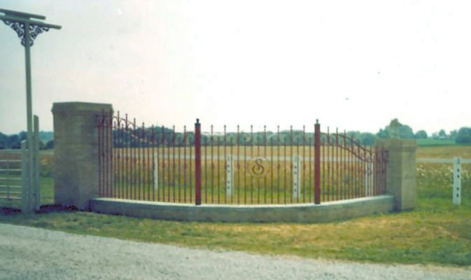 arched and curved wrought iron entrance fence