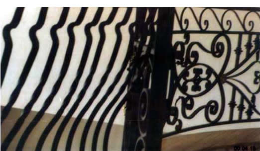 close up of detail in wrought iron a railing panel