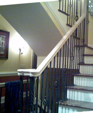 wrought iron atair rail with an oak handrail
